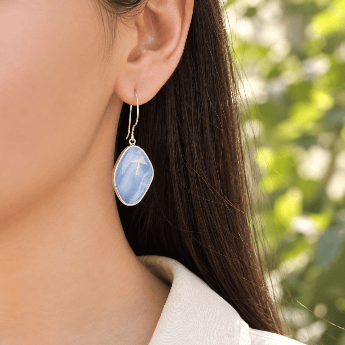 Model wearing 925 sterling silver blue lace agate drop earrings