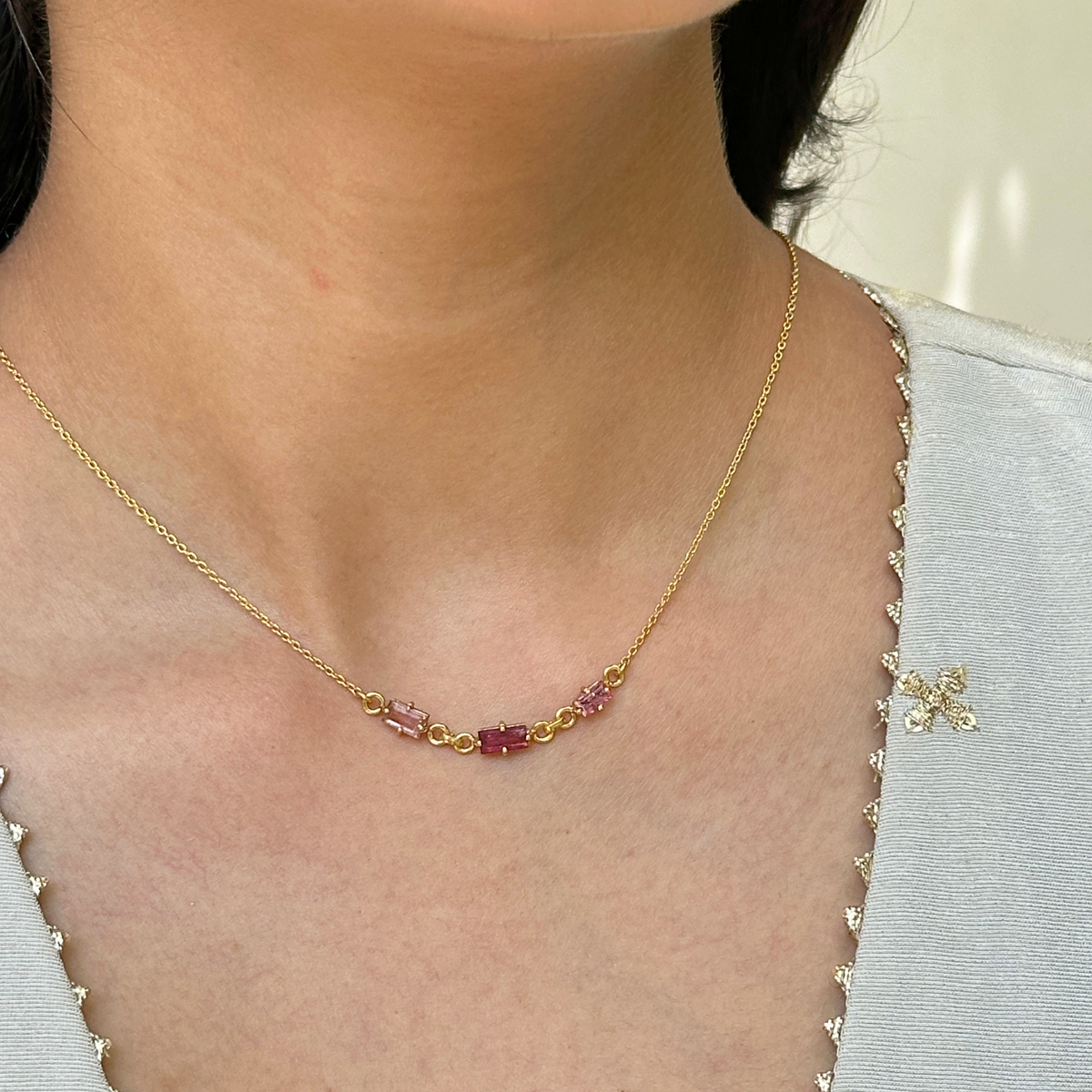 Woman wearing natural pink tourmaline baguette bar necklace
18k gold plated 925 silver minimal jewellery India