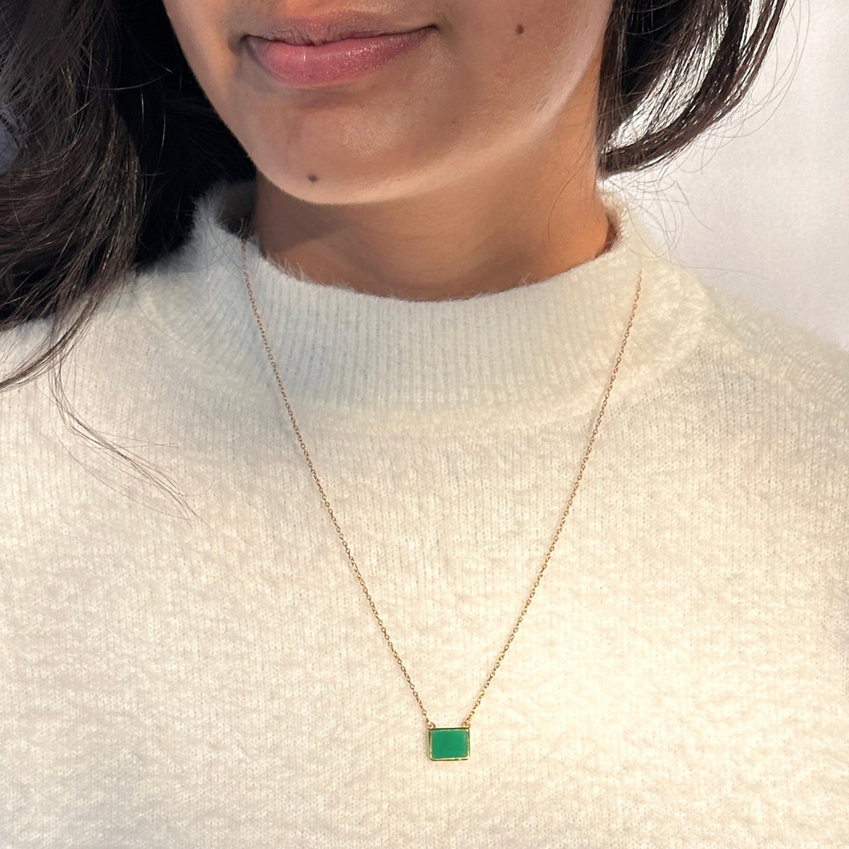 Green onyx silver 925 pendant necklace
Natural green onyx gemstone silver necklace
Green onyx 925 sterling silver pendant
Green onyx stone silver necklace India
Elegant green onyx silver necklace online
Minimal green pendant
minimal pendant
minimal jewelry
Person wearing a gold necklace with a green pendant