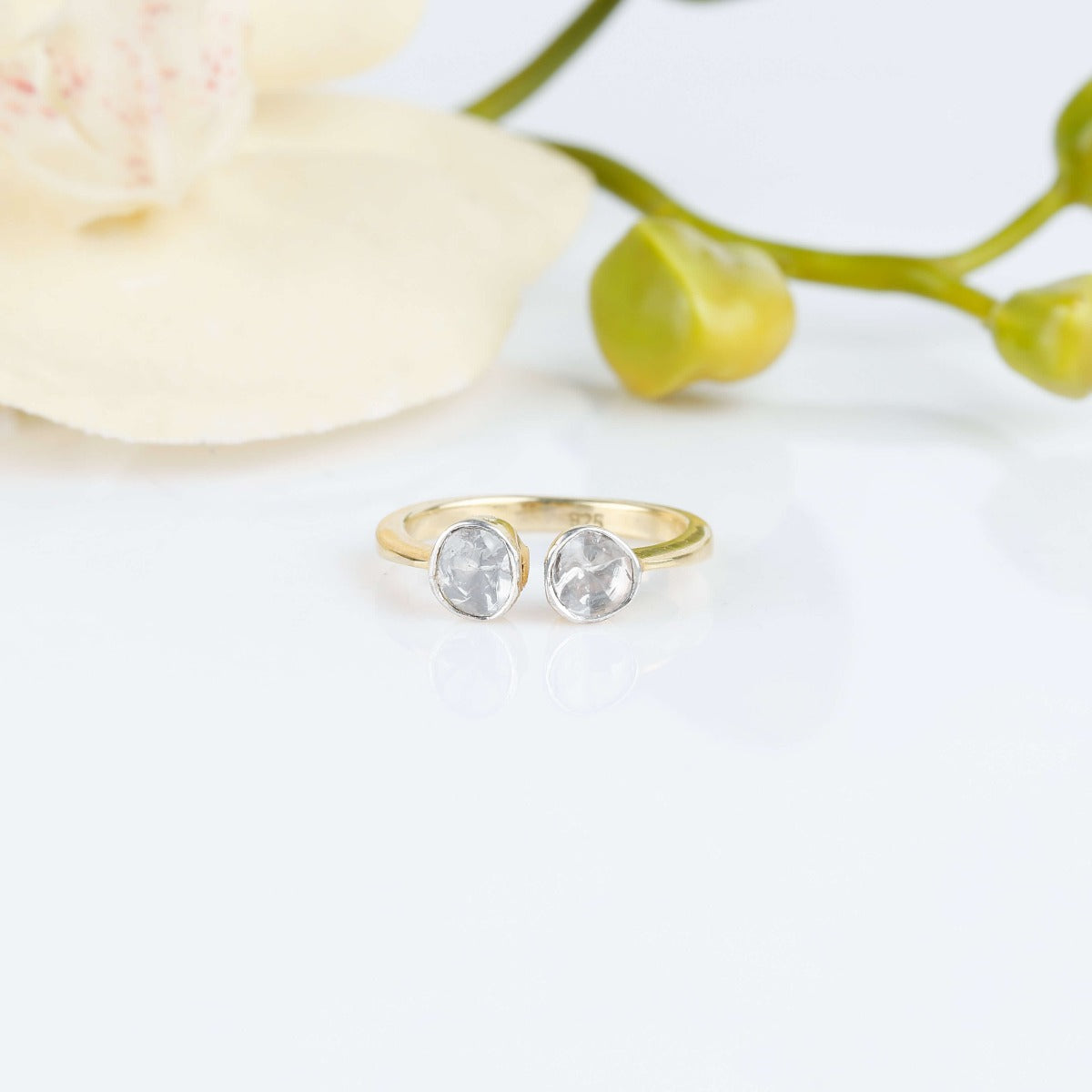 Two faced gold plated diamond ring