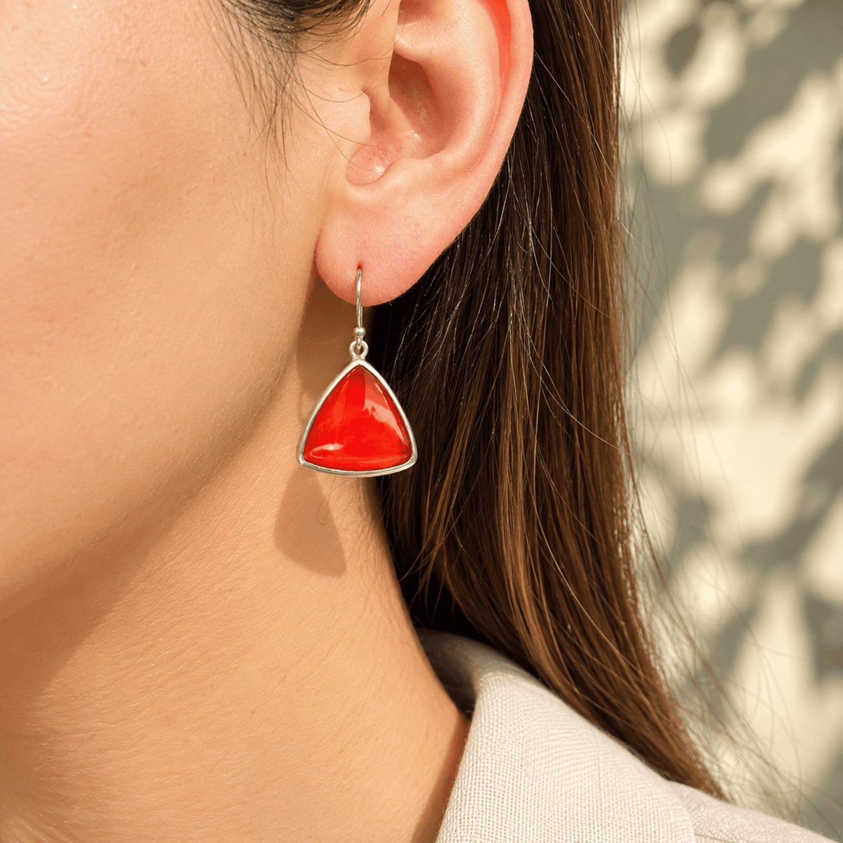 Model wearing 925 sterling silver carnelian triangle drop earrings