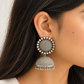 Model wearing big oxidised 925 silver granulated jhumka earrings