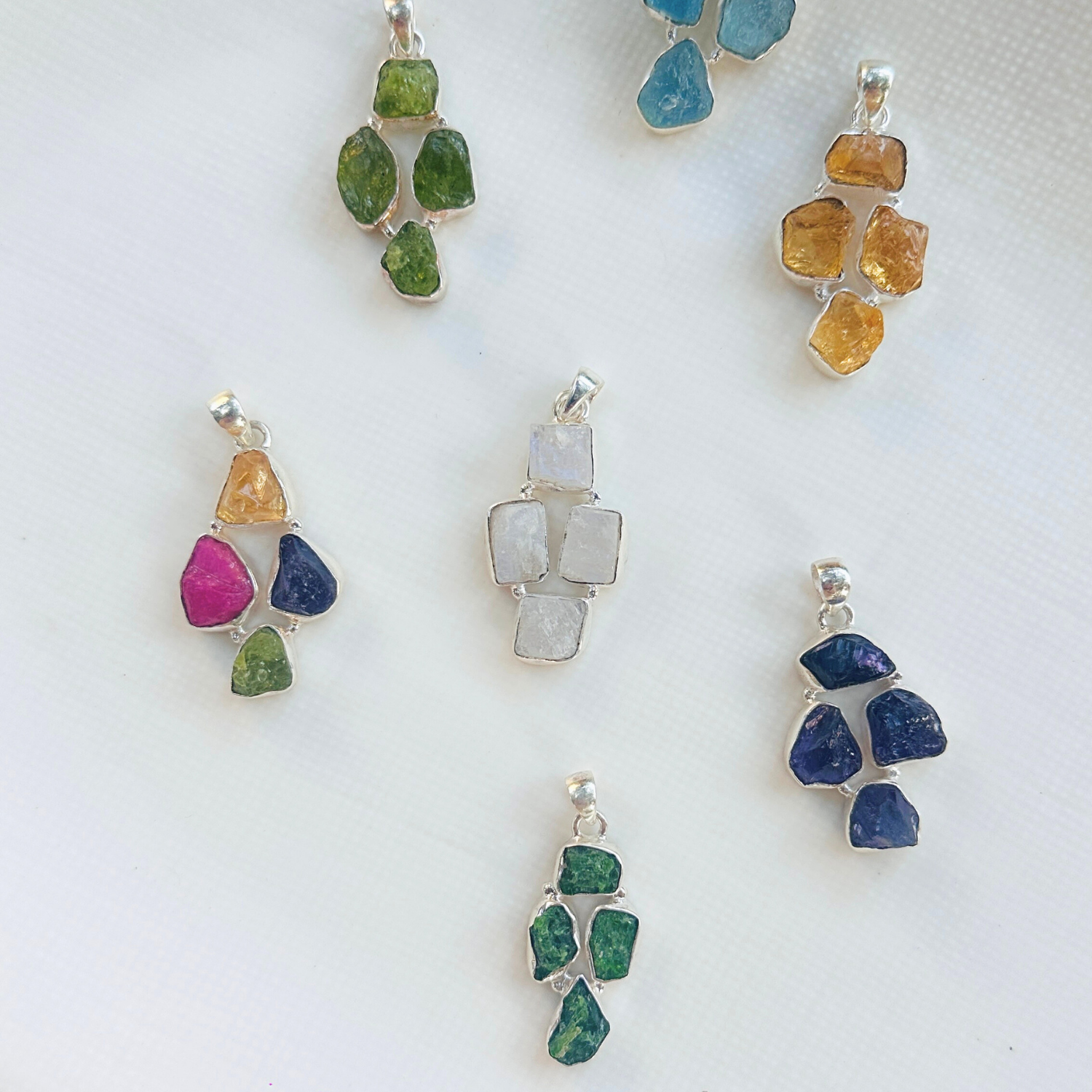 Minimal Pendants
Colorful Pendants
Gemstone Pendant
Peridot Pendant
Aquamarine Pendant
Citrine Pendant
Rainbow Moonstone Pendant
Amethyst Pendant
Minimal silver pendant
Green pendant
Blue pendant
yellow pendant
White pendant
Multicolor pendant
Pendant for women
Gifts for women
Silver pendant 925

Collection of colorful gemstone pendants on a white surface