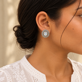 Model wearing oxidised 925 silver moonstone stud earrings
