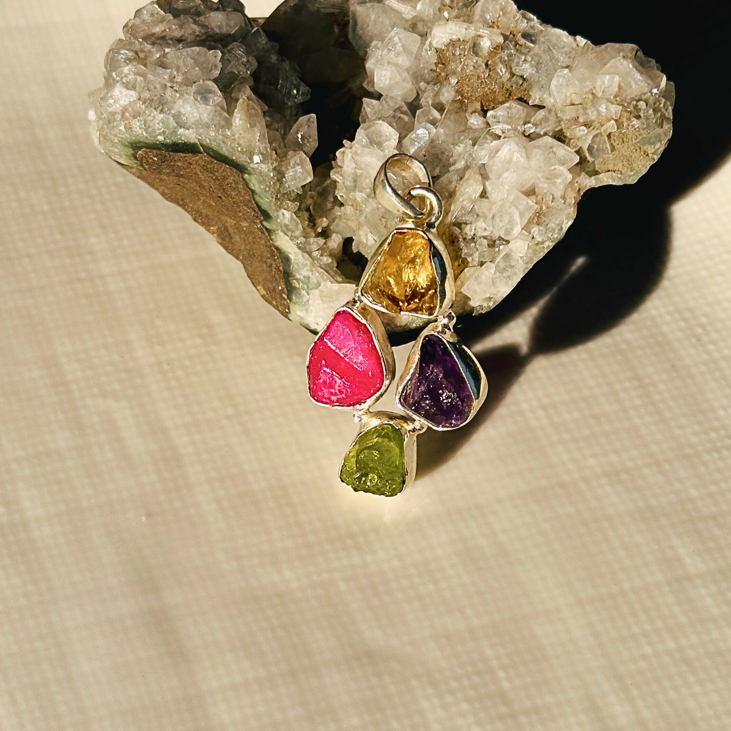 Minimal Pendants
Colorful Pendants
Gemstone Pendant
Peridot Pendant
Citrine Pendant
Amethyst Pendant
Minimal silver pendant
Green pendant
Purple pendant
yellow pendant
Multicolor pendant
Pendant for women
Gifts for women
Silver pendant 925

Collection of colorful gemstone pendants on a white surface

Multicolored gemstone pendant on a textured beige surface with a crystal background