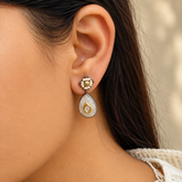 Model wearing 925 silver moonstone drop earrings with polki
