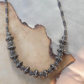 Silver beaded necklace on a textured surface

Silver Jewelry
925 Silver 
intricate Design Jewelry 