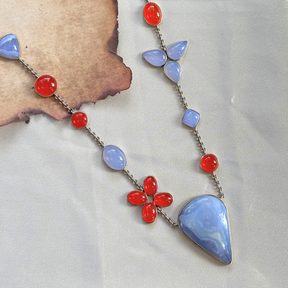 Necklace with colorful stones on a textured surface

Premium Chalcedony & Carnelian Silver Jewelry Necklace

Handcrafted  Necklace 

Silver Jewelry 