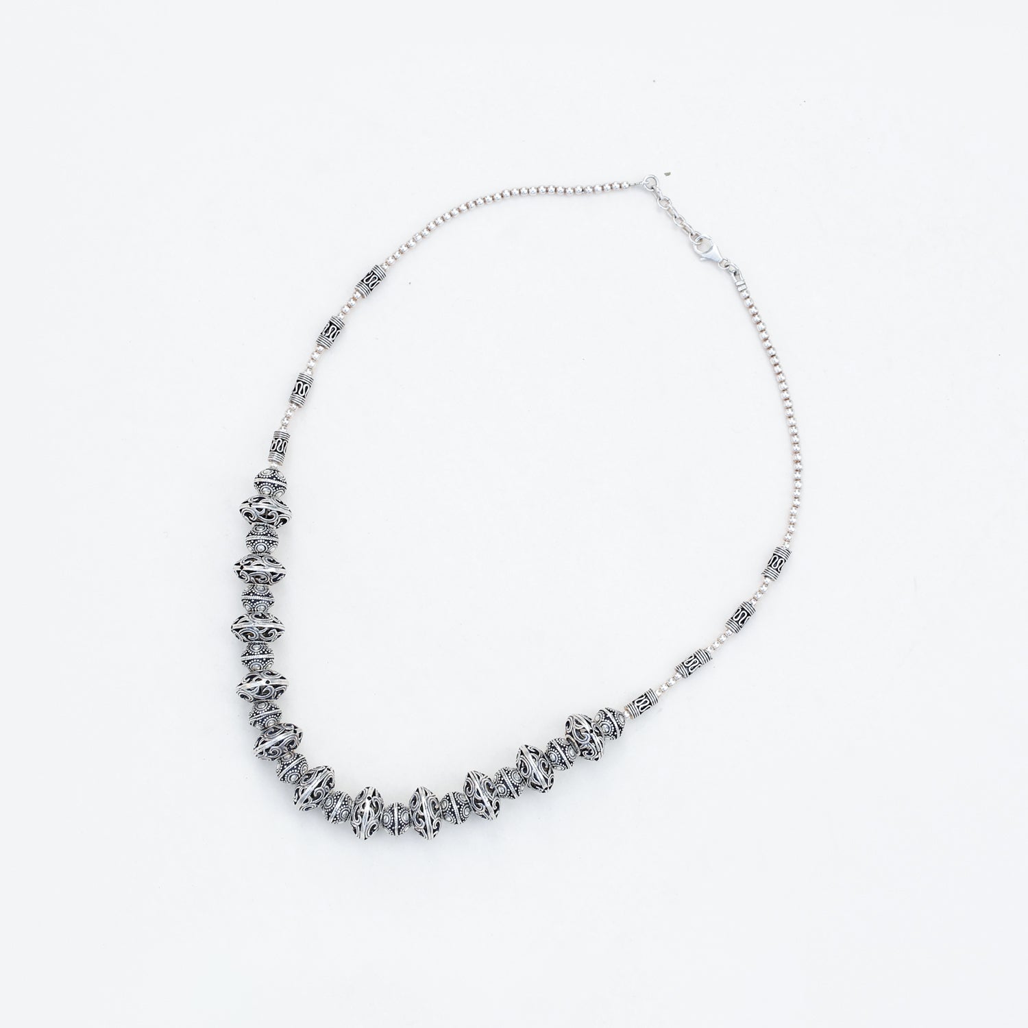 Silver necklace on a white background