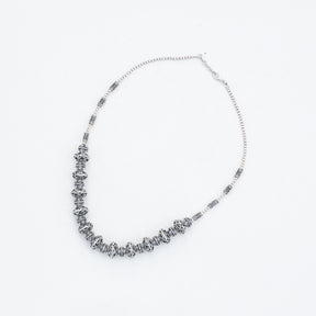 Silver necklace on a white background