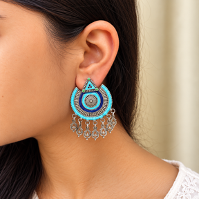 Model wearing oxidised 925 silver blue enamel chandbali earrings