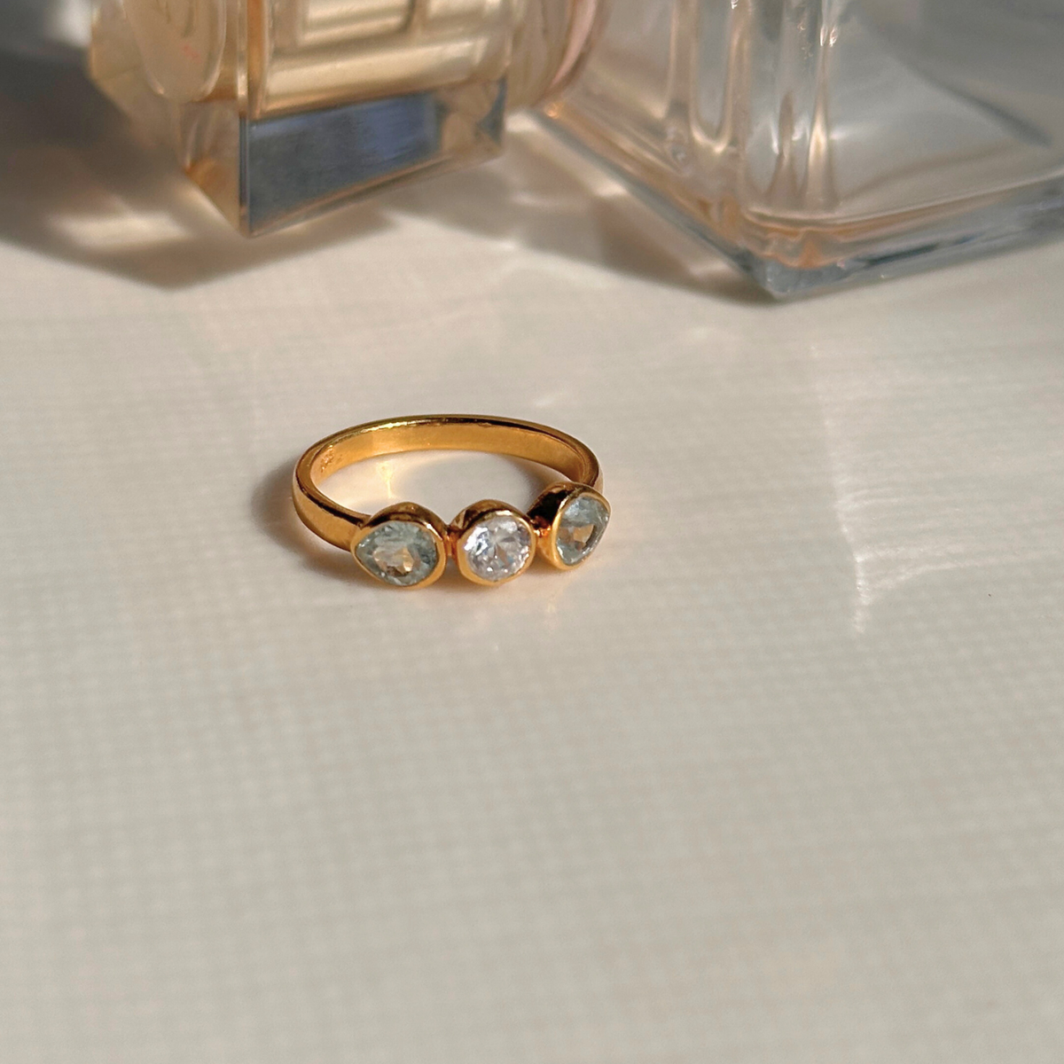 Multistone silver 925 minimal ring

Natural gemstone silver 925 minimalist ring

Multi stone 925 sterling silver ring

Minimal multistone silver ring India

Minimal ring

ring for daily wear 


Gold ring with three gemstones on a light surface