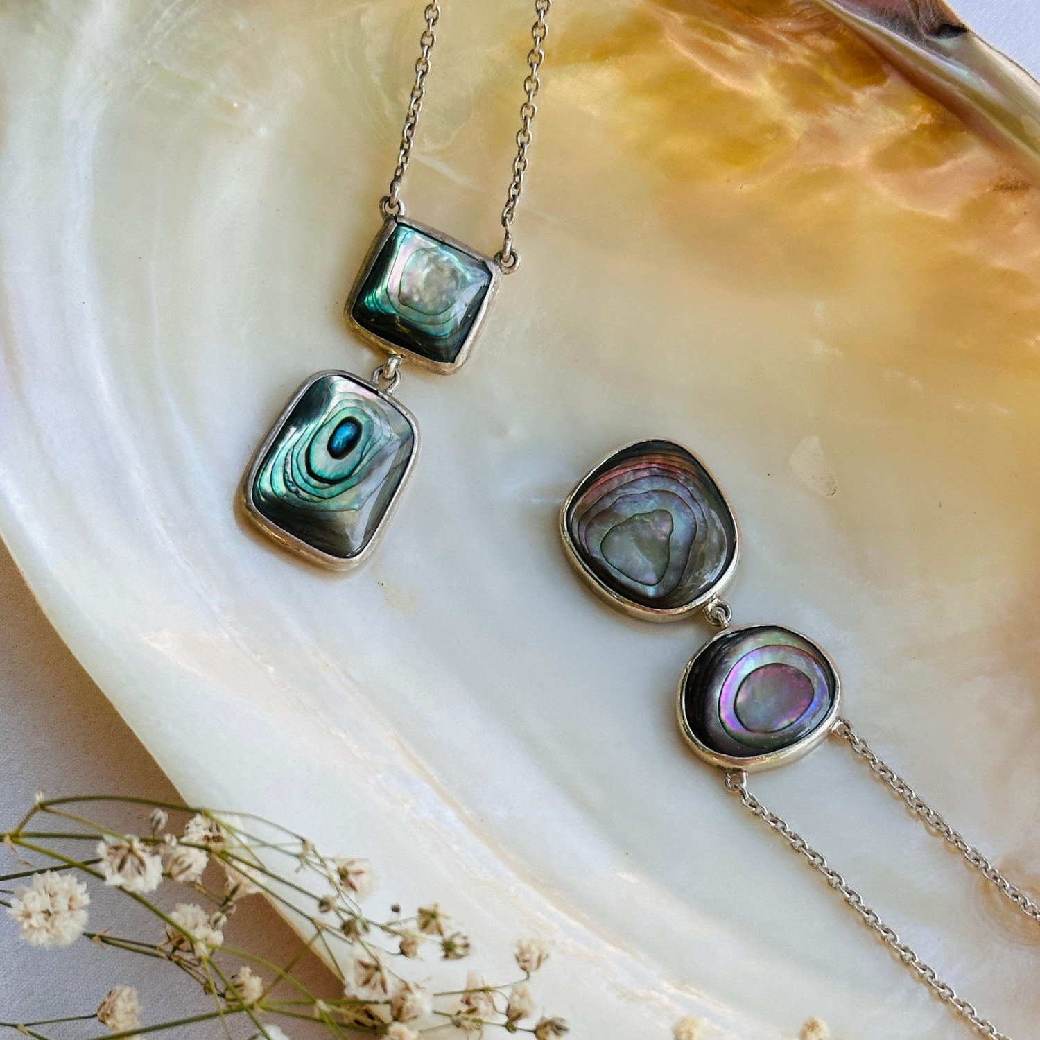 Abalone silver 925 pendant necklace

Natural abalone shell silver necklace

Iridescent abalone 925 sterling silver pendant

Abalone stone silver necklace 

Elegant abalone silver necklace online

Minimal Pendant necklace


Jewelry set with pendants on a shell background