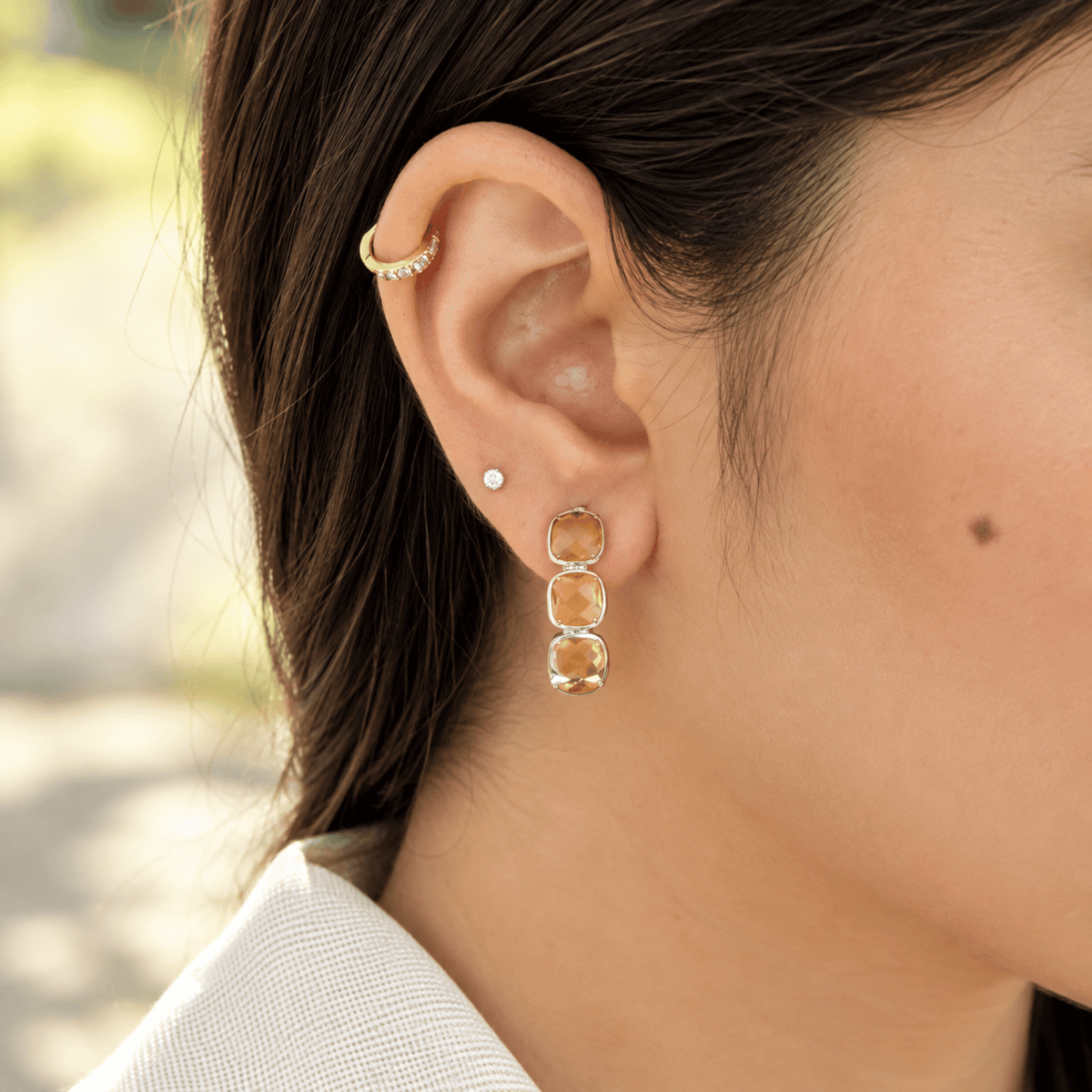 Model wearing 925 sterling silver citrine half hoop earrings