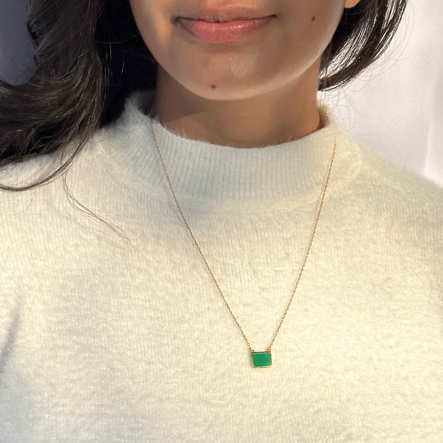 Natural green onyx gemstone silver necklace

Green onyx 925 sterling silver pendant

Green onyx stone silver necklace India

Elegant green onyx silver necklace online

Minimal green pendant 

minimal pendant 

minimal jewelry 

Person wearing a gold necklace with a green pendant