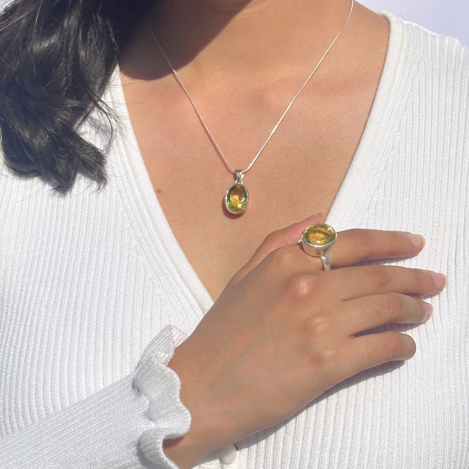 Lemon quartz silver 925 pendant for women

Natural lemon quartz gemstone silver pendant

Soft yellow lemon quartz 925 silver pendant

Lemon quartz stone silver pendant

Minimal pendant 

Person wearing a silver necklace with a yellow pendant and matching ring on a white background