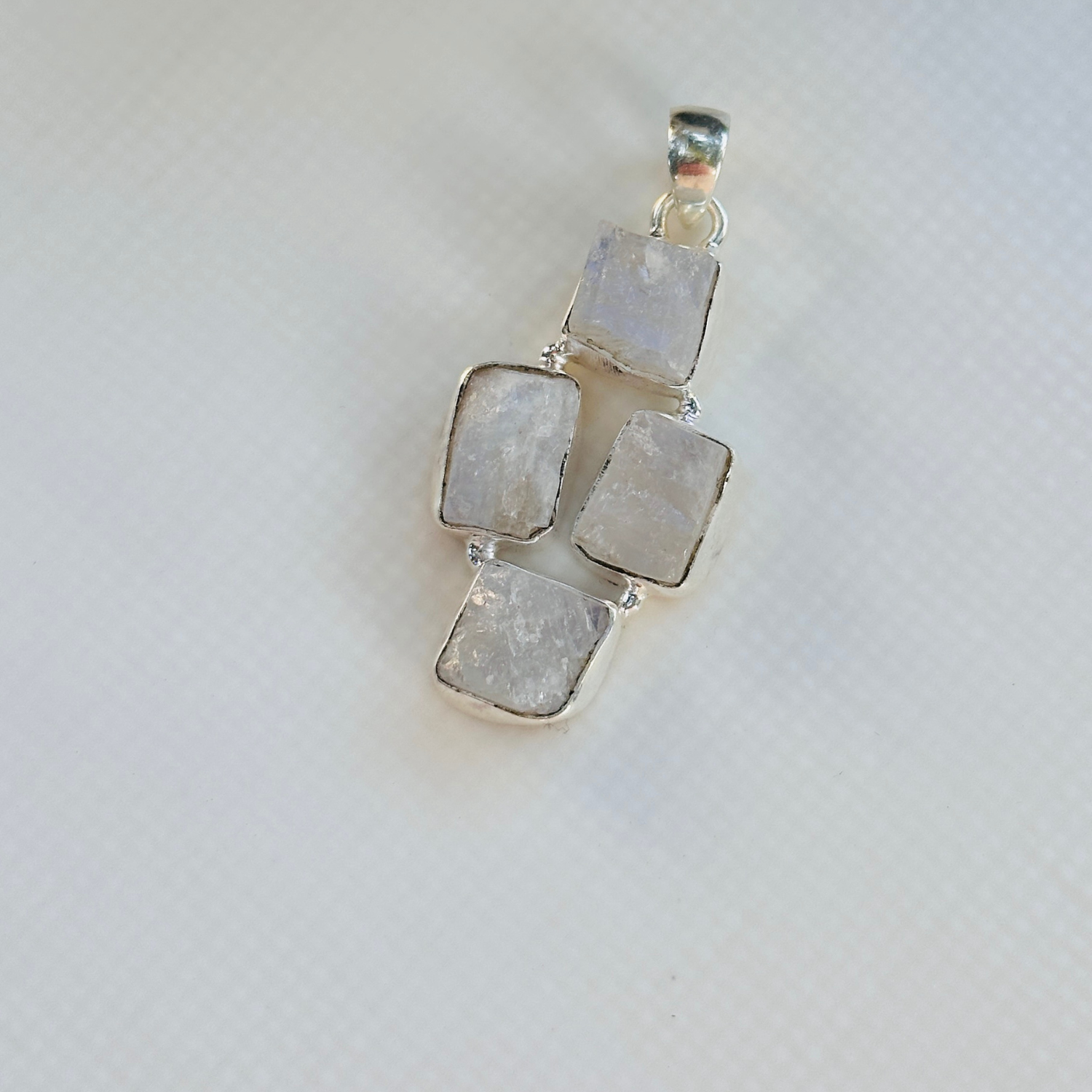 Minimal Pendants
Colorful Pendants
Gemstone Pendant
Rainbow Moonstone Pendant
Minimal silver pendant
White pendant
Pendant for women
Gifts for women
Silver pendant 925

Collection of colorful gemstone pendants on a white surface