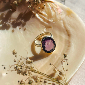 Natural amethyst gemstone silver ring

Purple amethyst 925 sterling silver Ring

Minimal ring

minimal amethyst Silver 925 ring

ring

Silver ring

Amethyst stone silver ring

Statement ring

Amethyst ring

Purple Jewelry 


Gold ring with a purple gemstone on a seashell with dried flowers