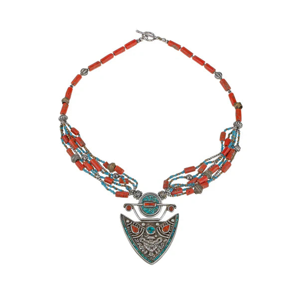 Necklace with coral beads and turquoise accents on a white background