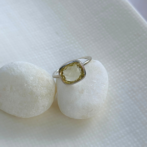 Silver ring with a green gemstone on two white stones

Natural lemon quartz gemstone set in 925 sterling silver ring

Handcrafted lemon quartz silver 925 ring for daily wear

Soft yellow lemon quartz stone silver ring with polished