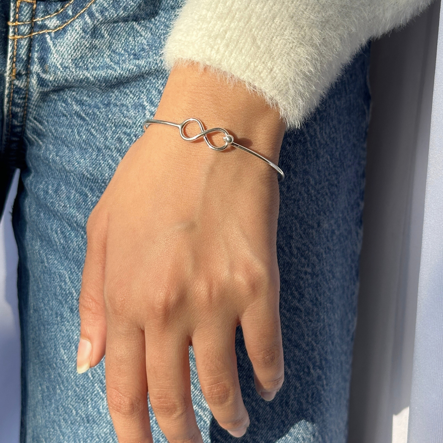 

Silver 925 cuff bangle for women

Sterling silver 925 open cuff bangle

Minimal silver 925 cuff bracelet

Minimal Bracelet 

minimal silver Bracelet 

bracelet 

Hand wearing a silver bracelet with a unique design, against a denim background.