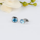 Alluring Blue Topaz Oval-shaped Silver Cufflinks