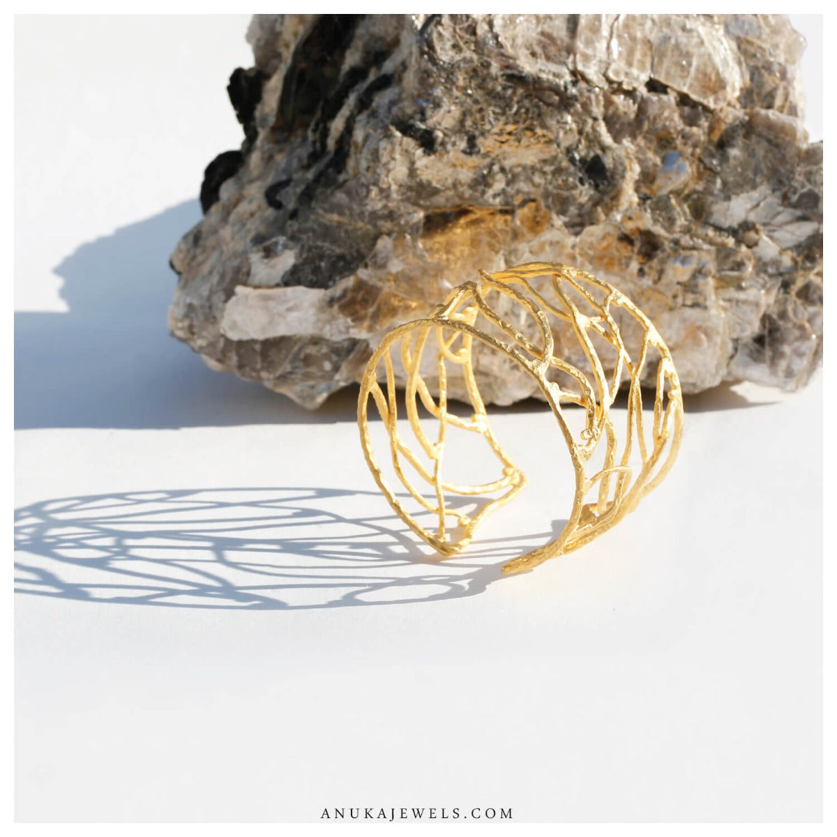 filigree detail on gold plated statement cuff bracelet