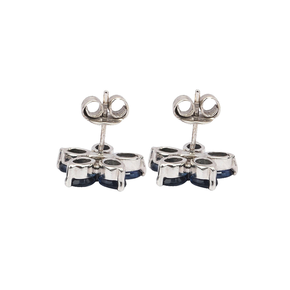 Silver ear studs in blue sapphire and diamond flower