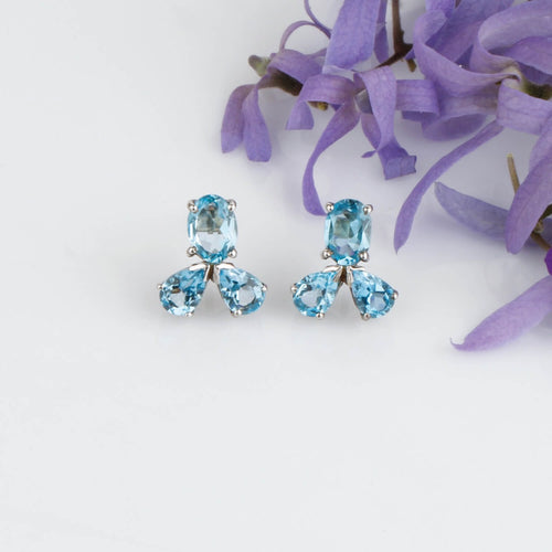 Gratifying blue topaz silver studs