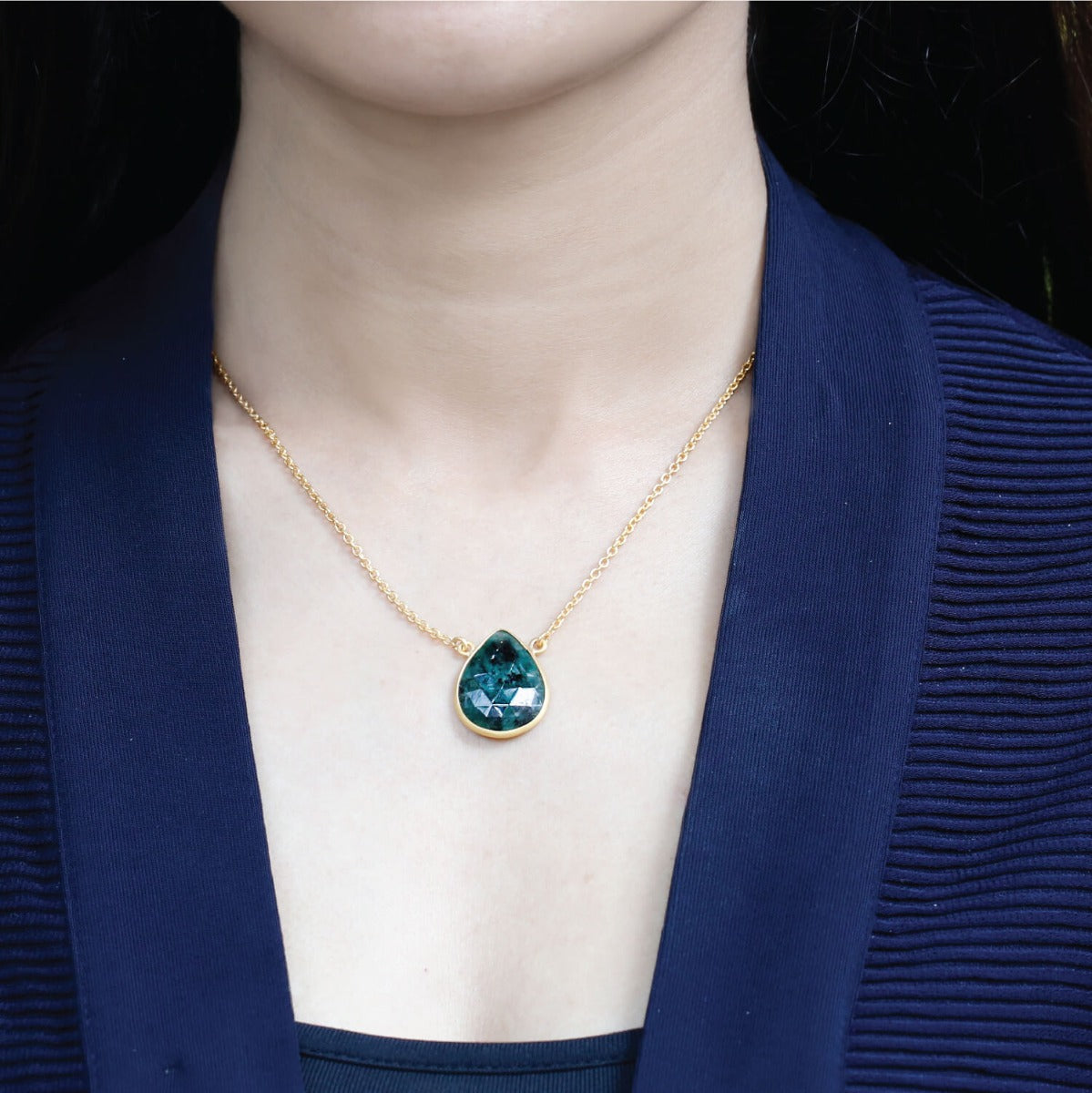 Winsome emerald  leaf shaped gold plated silver pendant