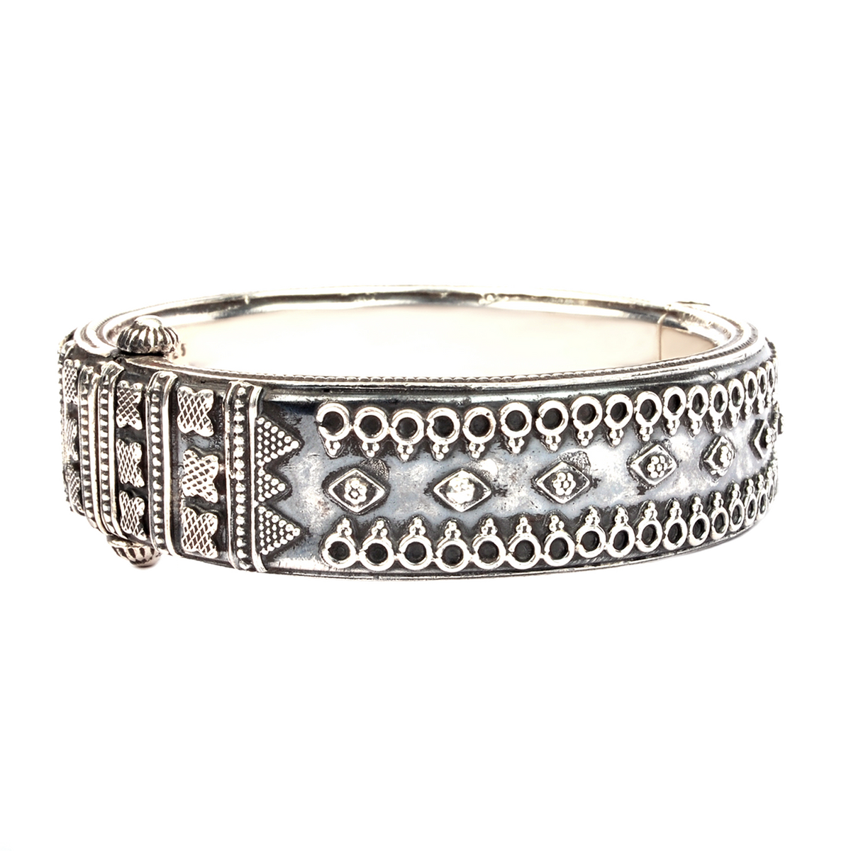 Thick oxidised silver bangle with tribal embossed motifs